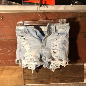 blue ripped denim jean shorts